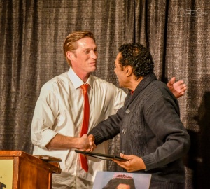 Brian Austin, iconic Blues musician from the Delta, presents Bobby Rush a plaque and lifetime membership to the Port City Blues Society. Credit: Cindy Tutt Scaife Photography